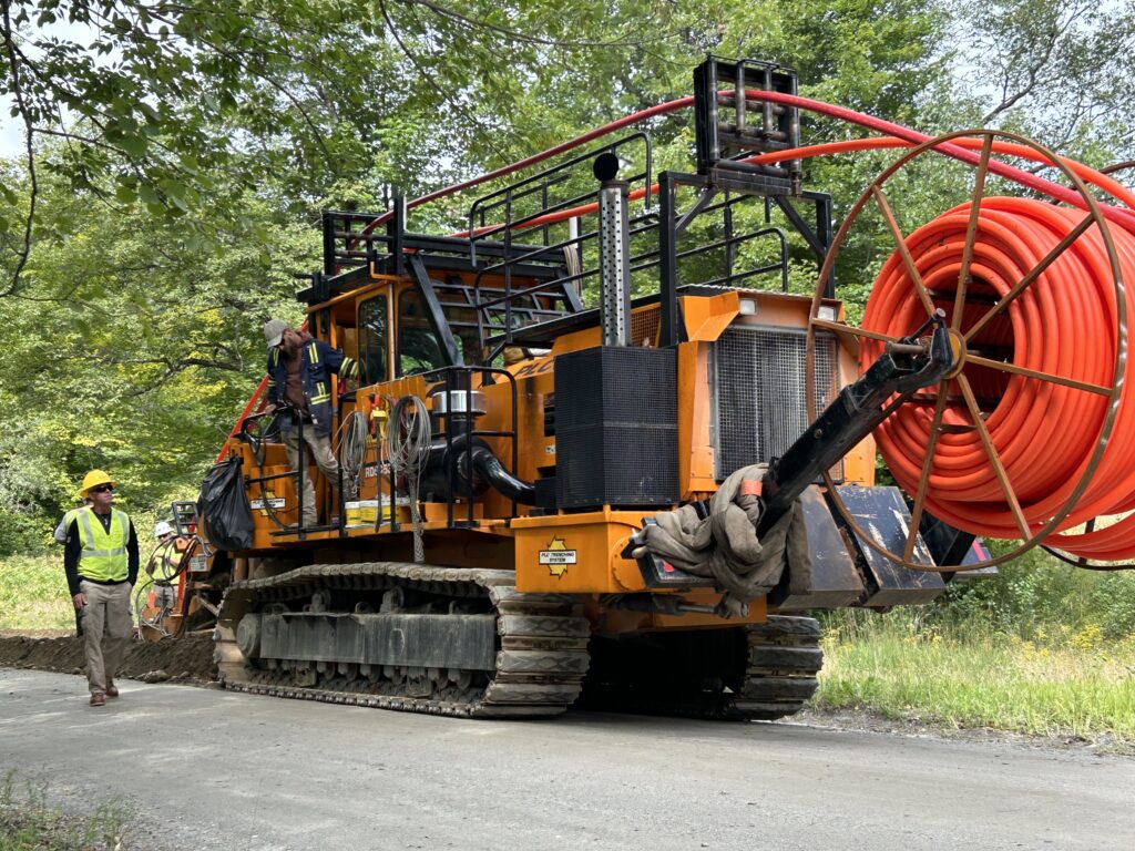 GMP’s Don Mills standing next to an undergrounding machine